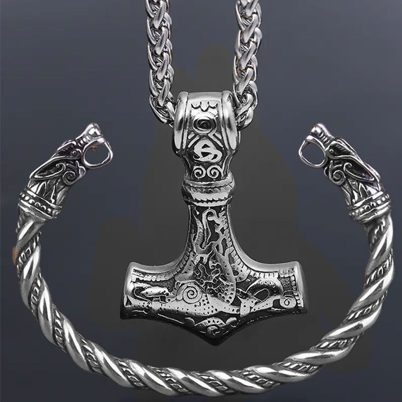 Set of 2 Viking Vintage Wolf Head Talisman Jewelry Pieces: Necklace and Bracelet. Featuring a Men's Nordic Hammer Pendant Necklace and a Women's Punk Hip Hop Handsome Necklace. High quality Wolf Head Bracelet included in this Fashion Jewelry Set, perfect