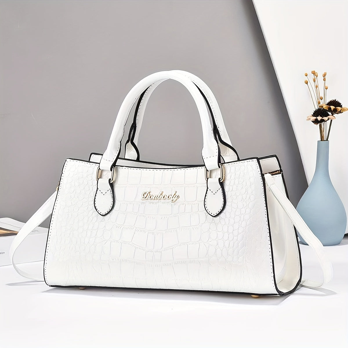 Модная женская сумка из черной кожи с тиснением под крокодила, с регулируемым ремнем, застежкой на молнии и ручкой на запястье. Легкая и универсальная для повседневного использования, может носиться как через плечо, так и на плече.