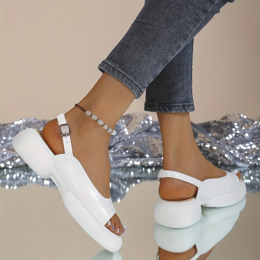 Yoz uchun yumshoq taglik va qulay blok to'pi bilan ayollar uchun nafis bir rangli bilakdan bog'langan sandallar.