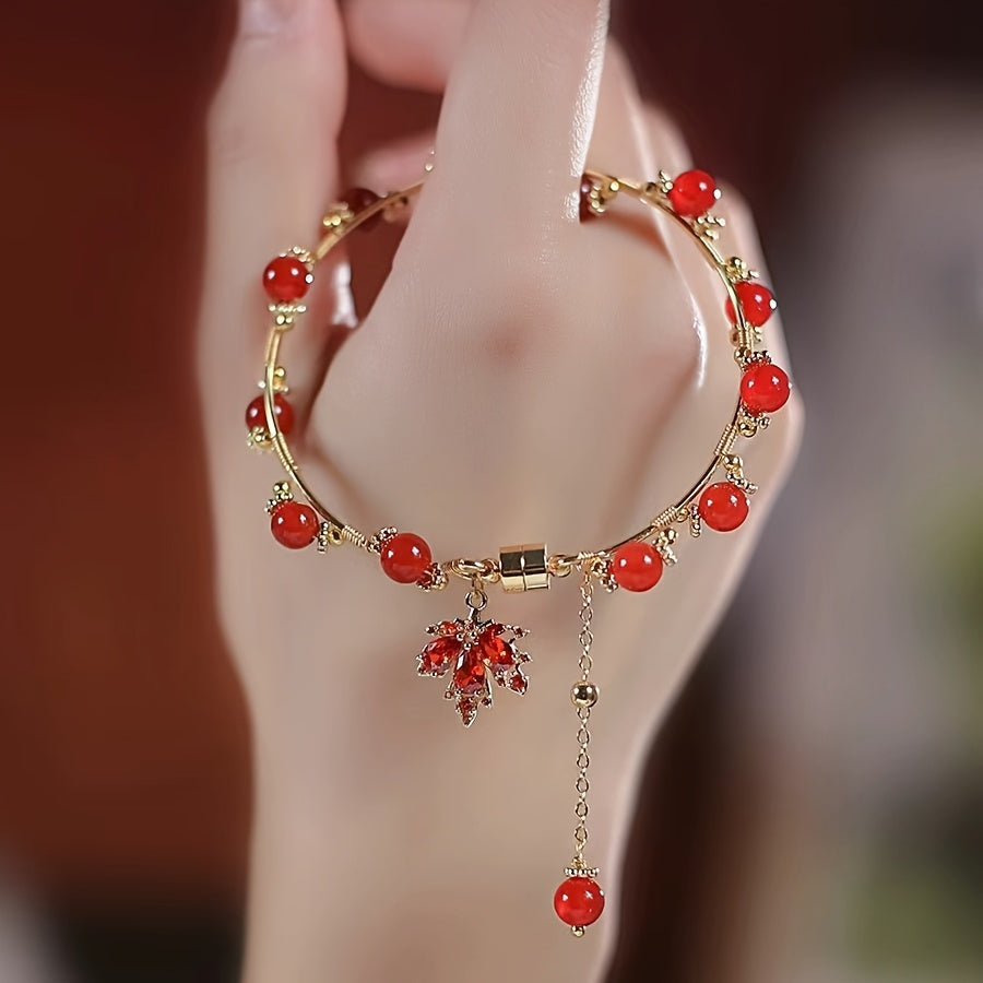 Vintage nafis uslubdagi bilaguzuk, nozik qizil xarang yaproqlari bilan pendanti, mis zargarlikdan tayyorlangan. Ushbu omadli qo'l ipi ayollar uchun mos keladi.