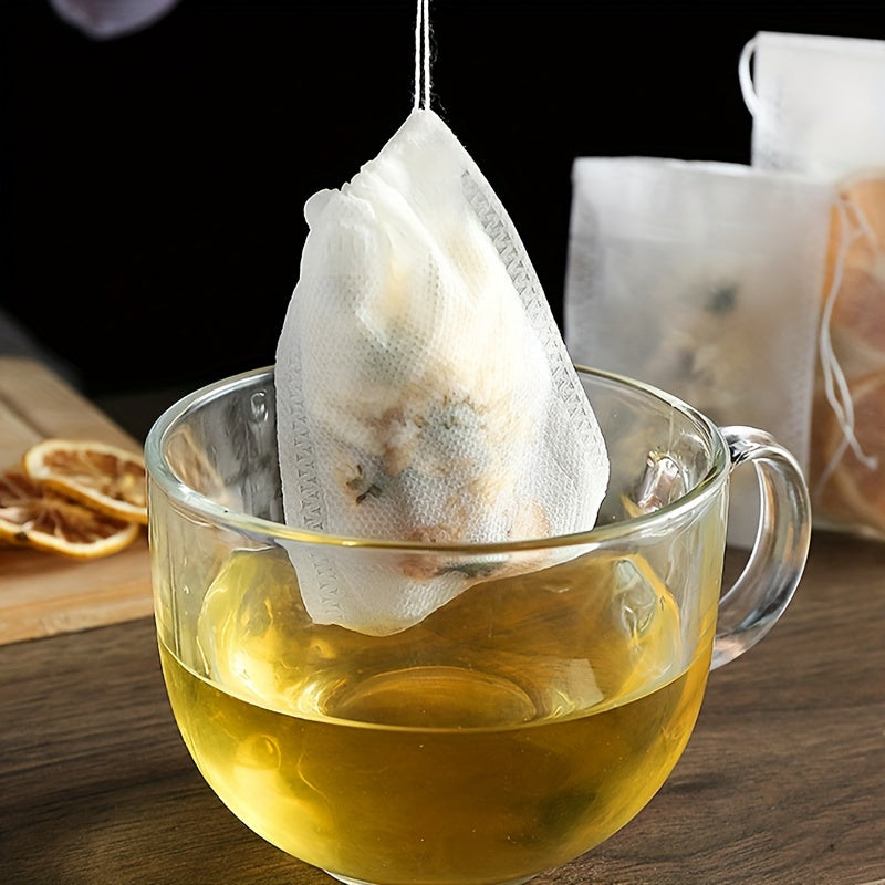 10 yoki 20 dona tortish qopqog'i bilan bir martalik choy filtr sumkalari, choy va ziravorlarni tayyorlash uchun to'qilmagan matodan tayyorlangan