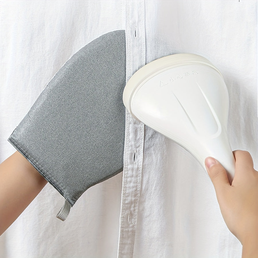 Portativ qo'l bilan ishlatiladigan kiyimlarni dazmollash taxtasi, oson burishlarni olib tashlash uchun yuqori haroratga chidamli g'ovak bilan.