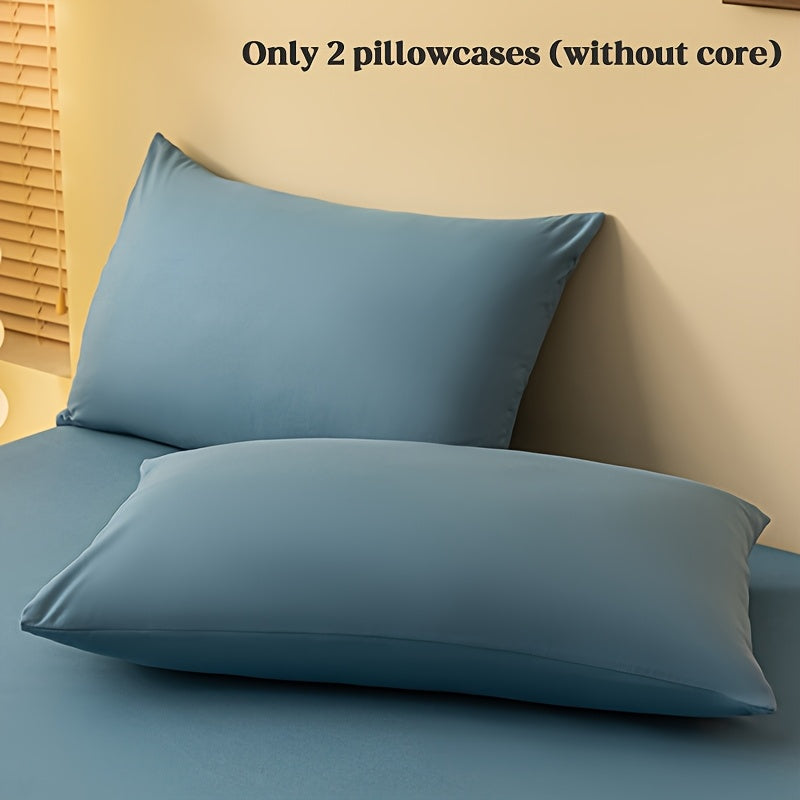 2 ta yostiq qopqog'i, bir rangda, yumshoq va qulay polyester materialidan tayyorlangan, konvert yopilishi bilan, yuvish mashinasida tozalash oson, 90gsm, yotoqxona, mehmonxona yoki mehmonxona to'shagi uchun ideal.