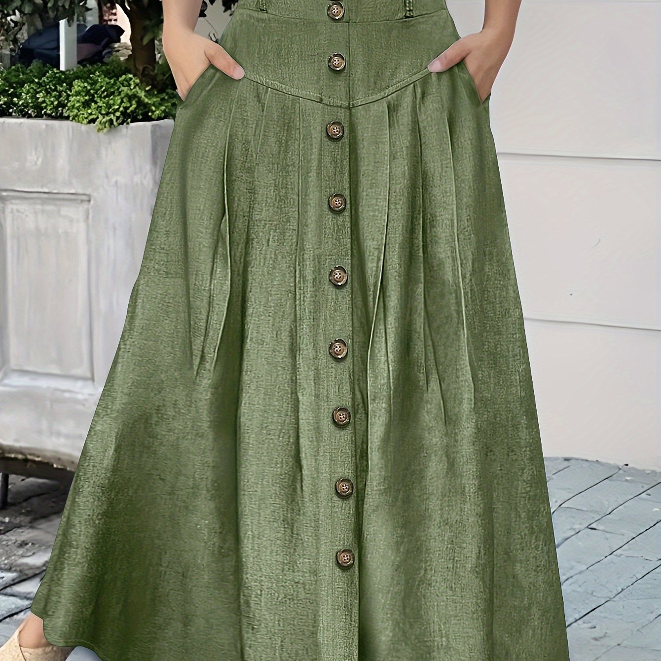 Falda de poliéster tejida de color sólido para mujer con doble bolsillo y botones en la parte delantera para primavera y verano
