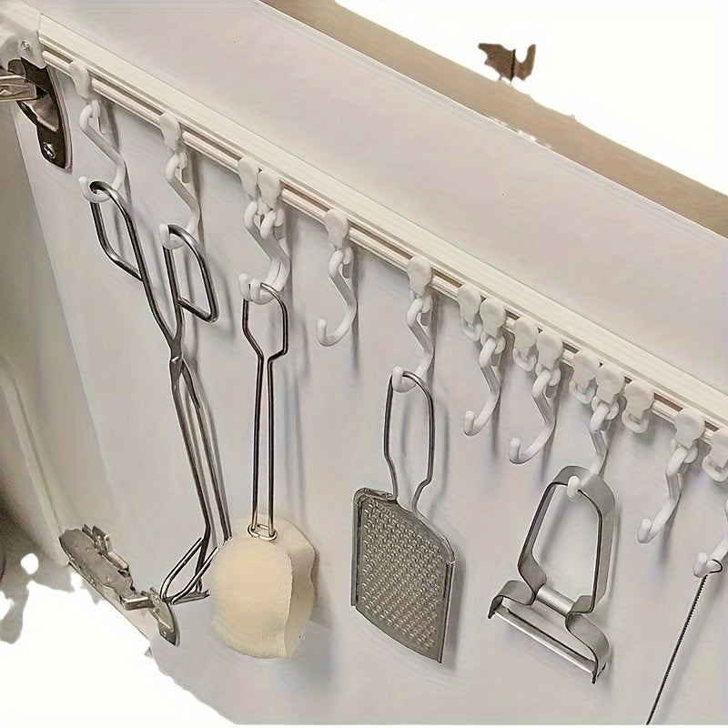 Oshxona asboblari uchun 6 ta ilgichli oq sirg'ash qopqog'i, burgusiz o'rnatish, devorlarga yoki eshiklarga osish uchun ideal. Mustahkam plastikdan tayyorlangan. Oshxona asboblarini tartibga solish uchun ajoyib.