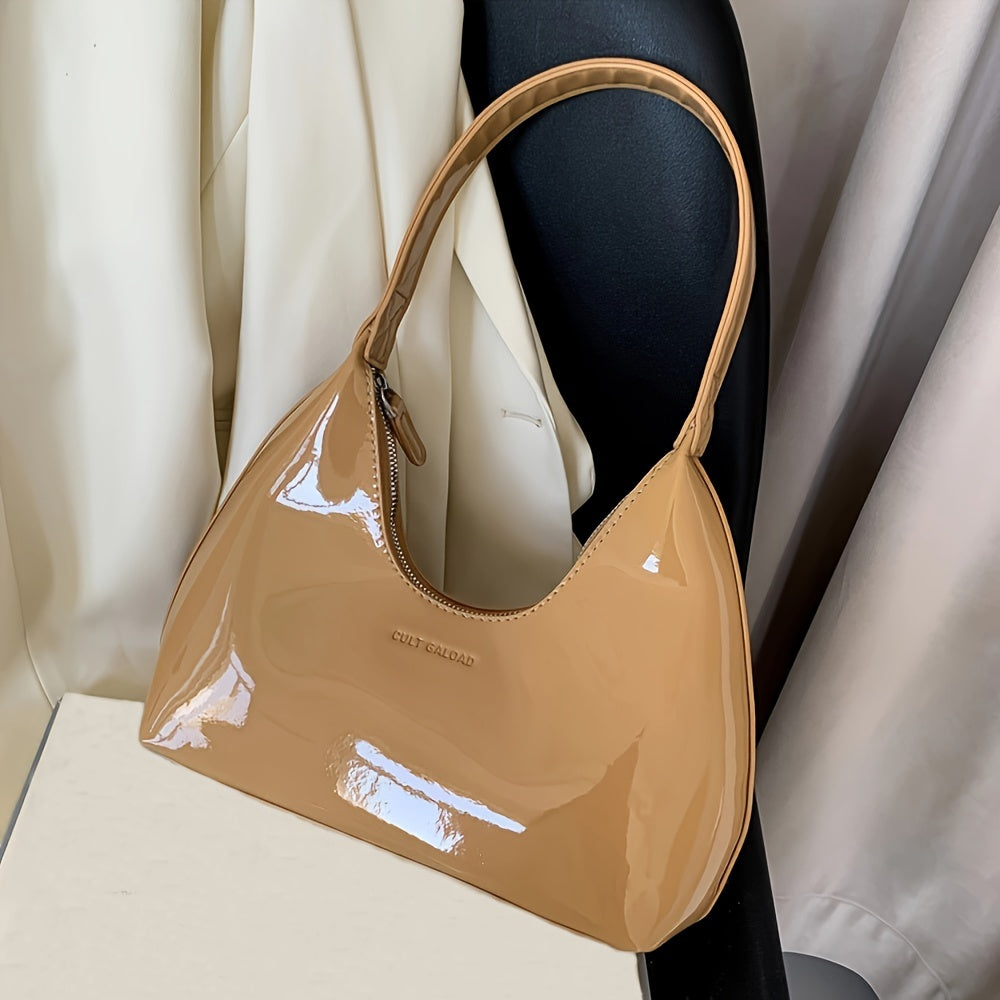 Шикарная красная сумка через плечо с глянцевой лакированной отделкой и застежкой на молнии, идеально подходящая для повседневного использования.