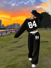 Conjunto de top y pantalones jogger de manga larga con letras y cuello asimétrico para mujer