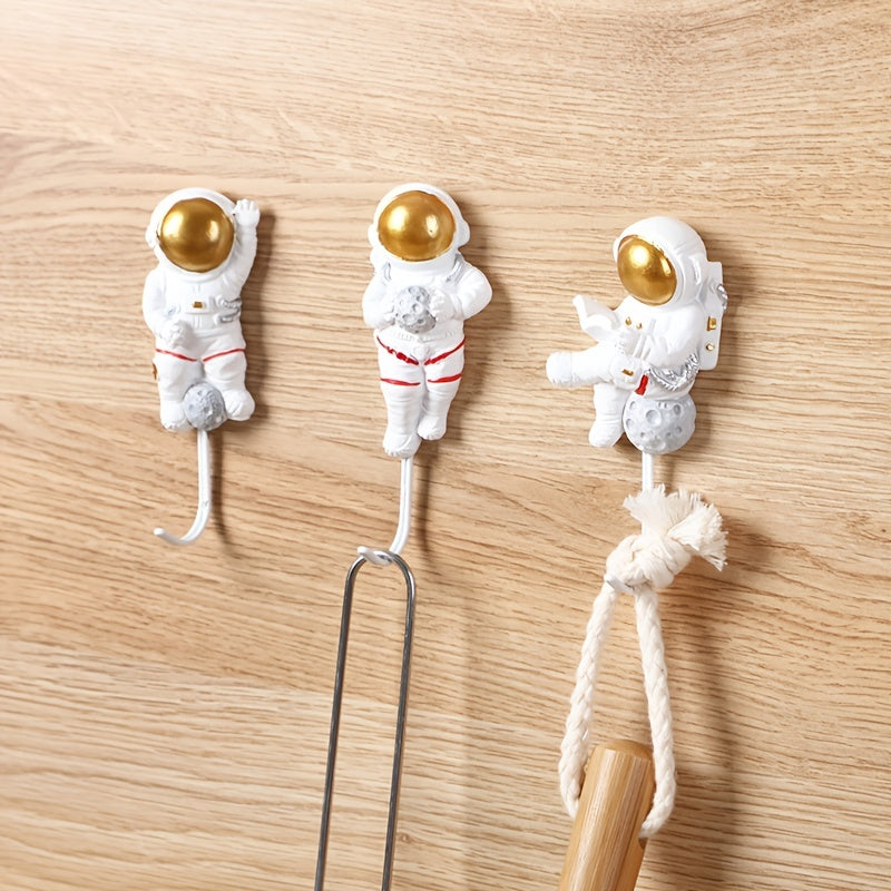 Ganchos de pared para cocina y puerta con diseño de astronauta adhesivo, fuerte y sin daños