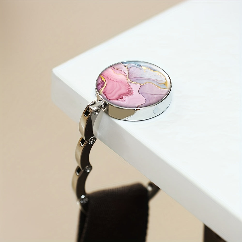 Percha de bolso plegable de mármol rosa, gancho portátil para bolsos en mesas