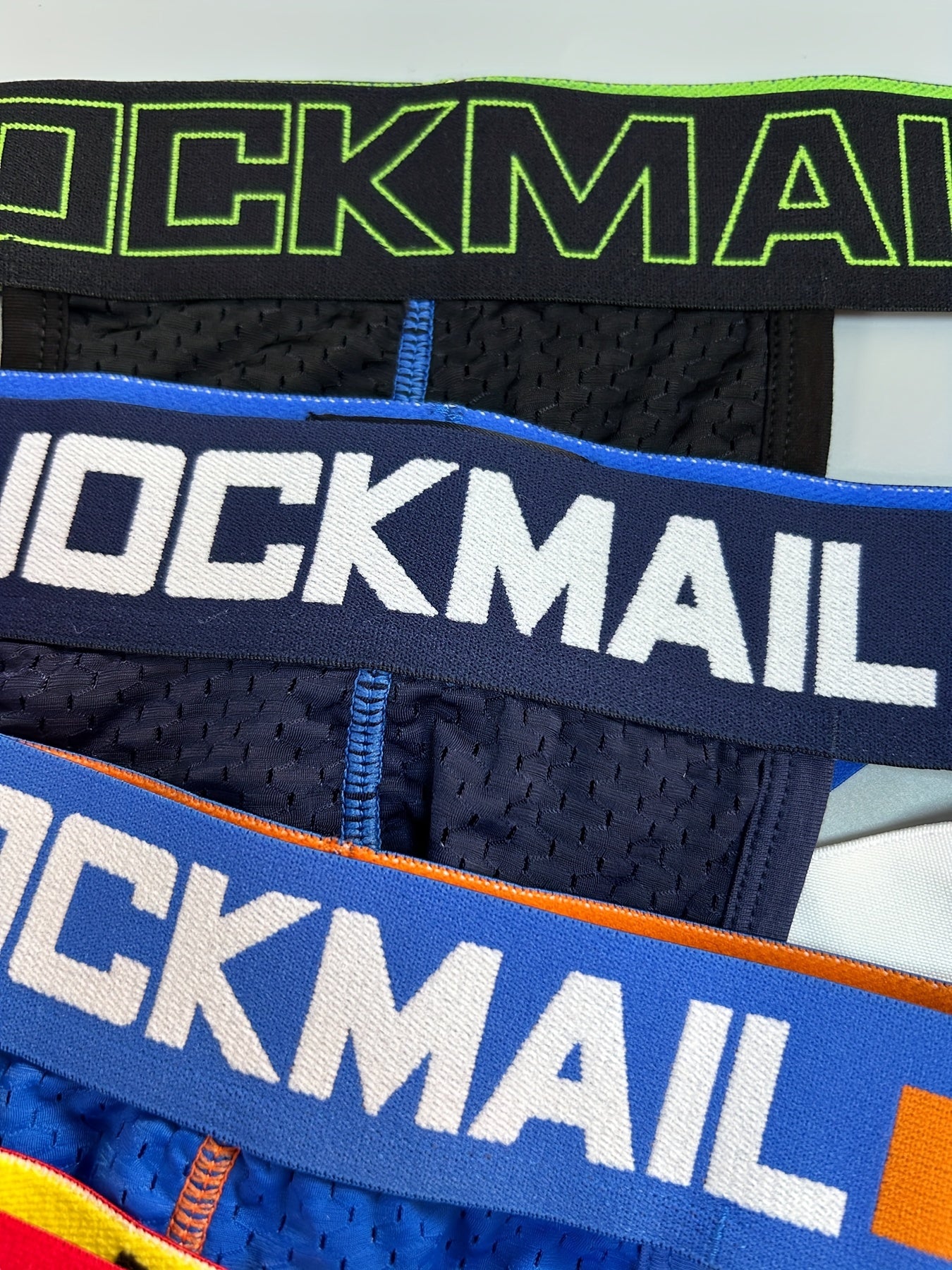 5 dona Aralash Rangli JOCKMAIL Havo O'tkazuvchi Naylon Tarmoq G-Stringlar Erkaklar uchun, Past Bel Thonglar M, L, XL, XXL o'lchamlarda. Kundalik kiyish yoki klub partiyalari uchun mukammal.