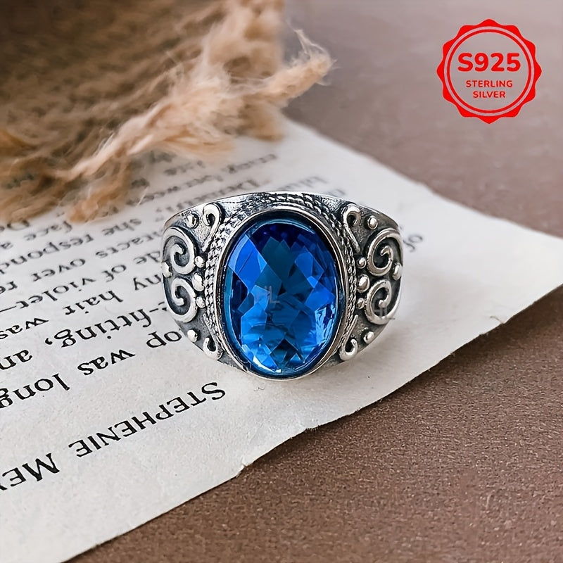 Vintage Style Sterling Silver Ring with Blue Zirconia and Carved Flower Design