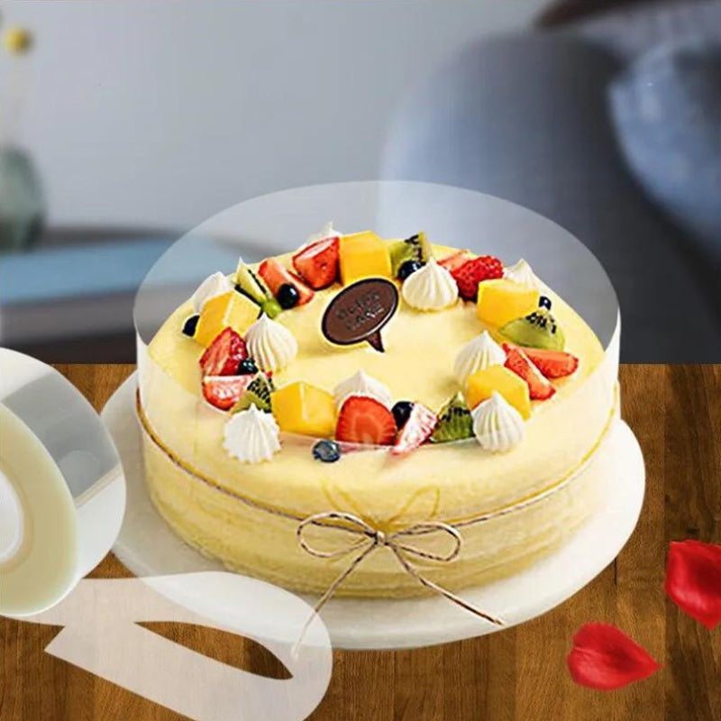 Shaffof asetat shokoladli konfet pishirish filmi bilan tayyorlangan qayta ishlatiladigan PET tort qopqog'i, qulflanishi bilan, muzlatgichda saqlash uchun mos. O'lchamlari 8 sm x 10 m yoki 10 sm x 10 m da mavjud.