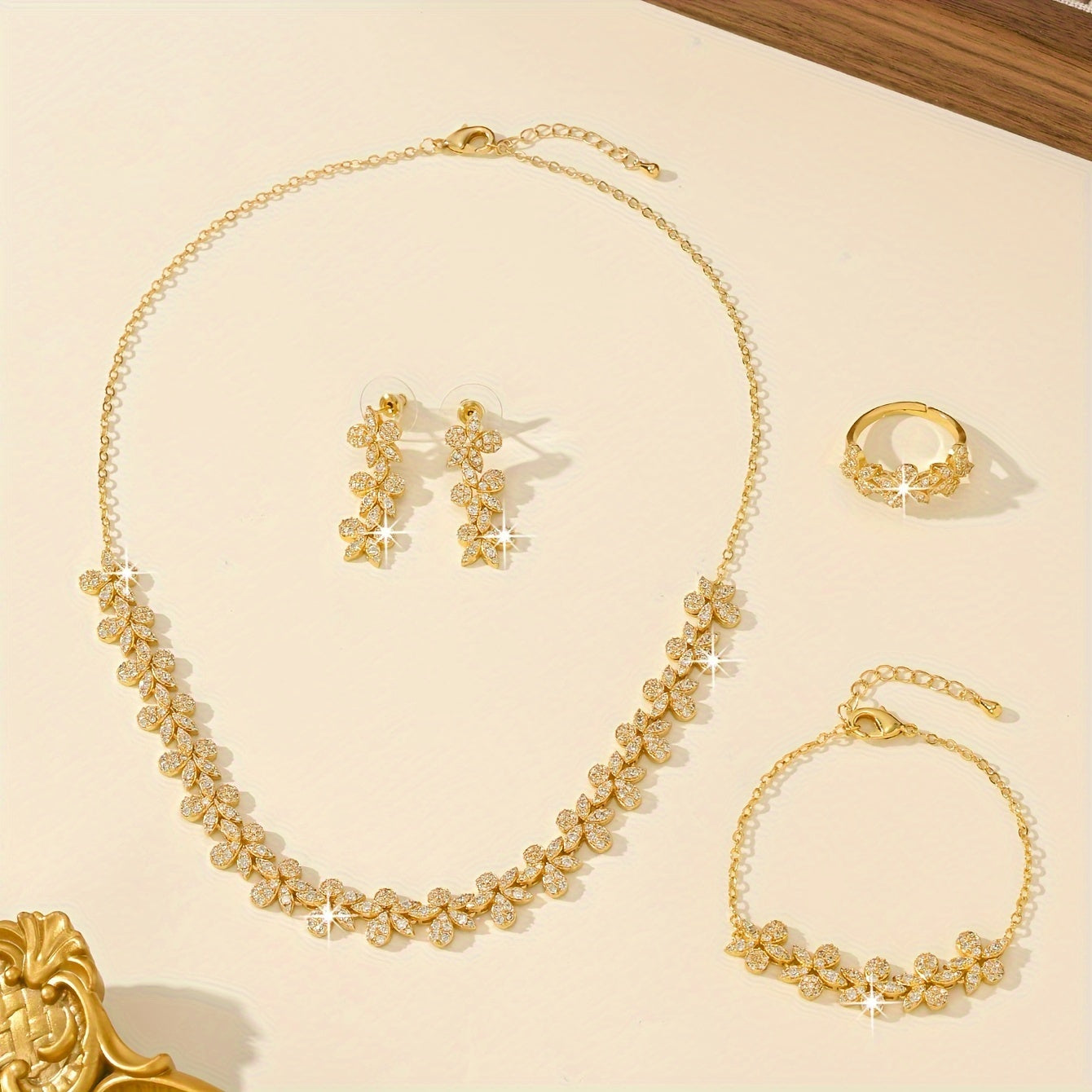 Luxurious Bridal Jewelry Set with Synthetic Zirconia, featuring a Stunning Flower Petal Design in 18K Gold Plating - Includes Necklace, Bracelet, Earrings, and Ring perfect for Wedding and Party Events. Made with Copper Base for utmost quality and