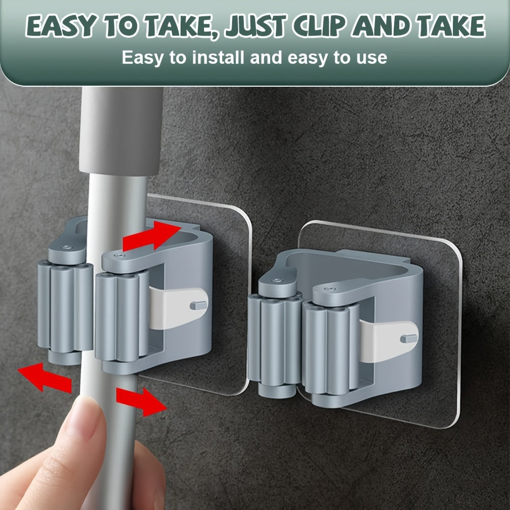 Soporte de pared blanco para trapeador y escoba con múltiples ganchos de plástico para almacenamiento en cocina y baño