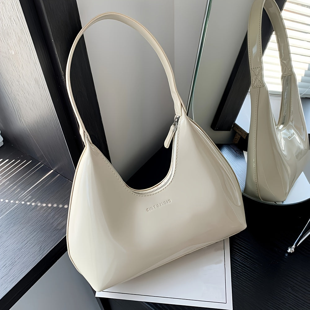 Шикарная красная сумка через плечо с глянцевой лакированной отделкой и застежкой на молнии, идеально подходящая для повседневного использования.