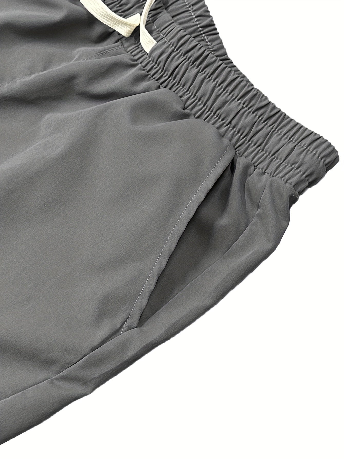 Yozgi ochiq havoda faoliyatlar uchun mukammal, yon cho'ntaklari bilan bir xil rangdagi erkaklar uchun qulay polyester yuk shimlar.