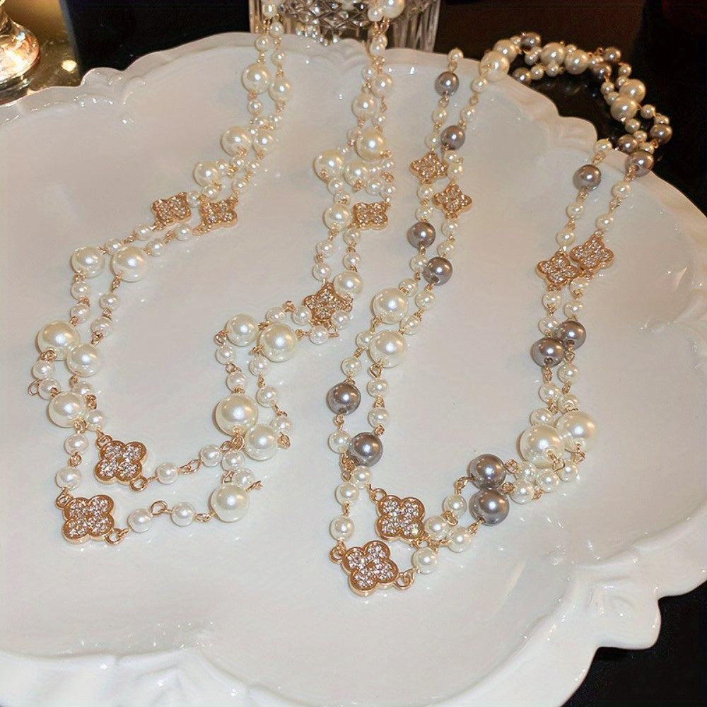 Fransuz uslubidagi vintage gullar va barglar rhinestone tafsilotlari bilan bezatilgan zamonaviy ko'p qatlamli soxta marvarid bilaguzuk, retro koreys modasining bayonot asari, ayollar uchun mukammal kuz va qish sviter zanjiri aksessuari.