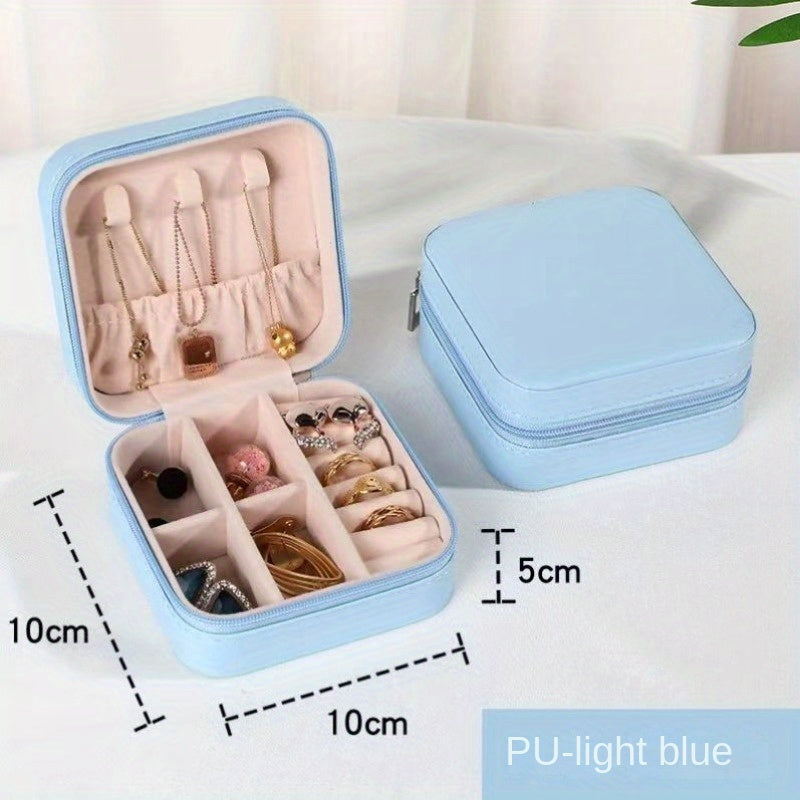 Klassik sun'iy charmdan yasalgan, uzuklar, marjonlar, bilakuzuklar va quloq bilagichlari uchun zip yopiq portativ sayohat zargarlik qutisi.