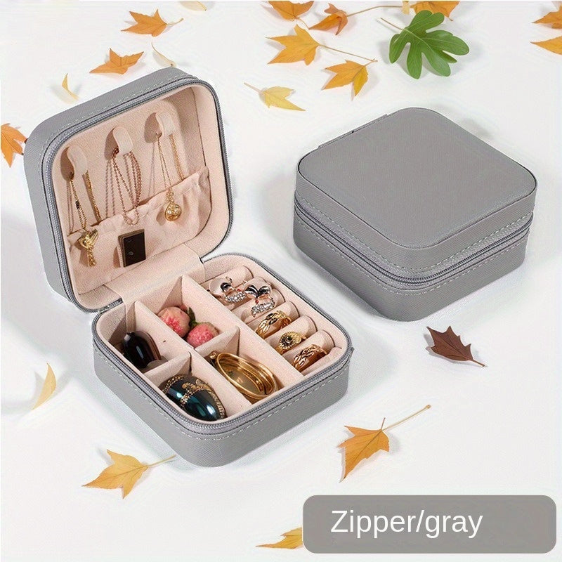 Klassik sun'iy charmdan yasalgan, uzuklar, marjonlar, bilakuzuklar va quloq bilagichlari uchun zip yopiq portativ sayohat zargarlik qutisi.