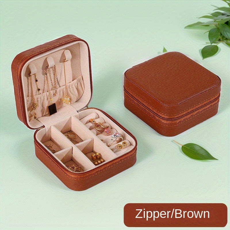 Klassik sun'iy charmdan yasalgan, uzuklar, marjonlar, bilakuzuklar va quloq bilagichlari uchun zip yopiq portativ sayohat zargarlik qutisi.