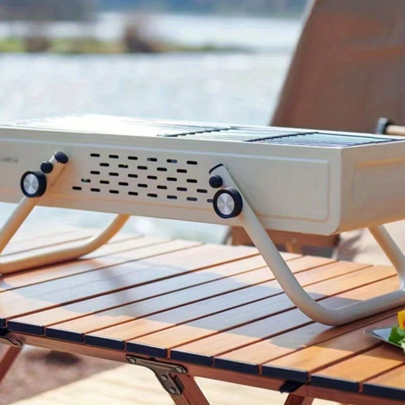 Tashqarida foydalanish uchun ideal portativ burilishli ko'mirli barbekyu grill.