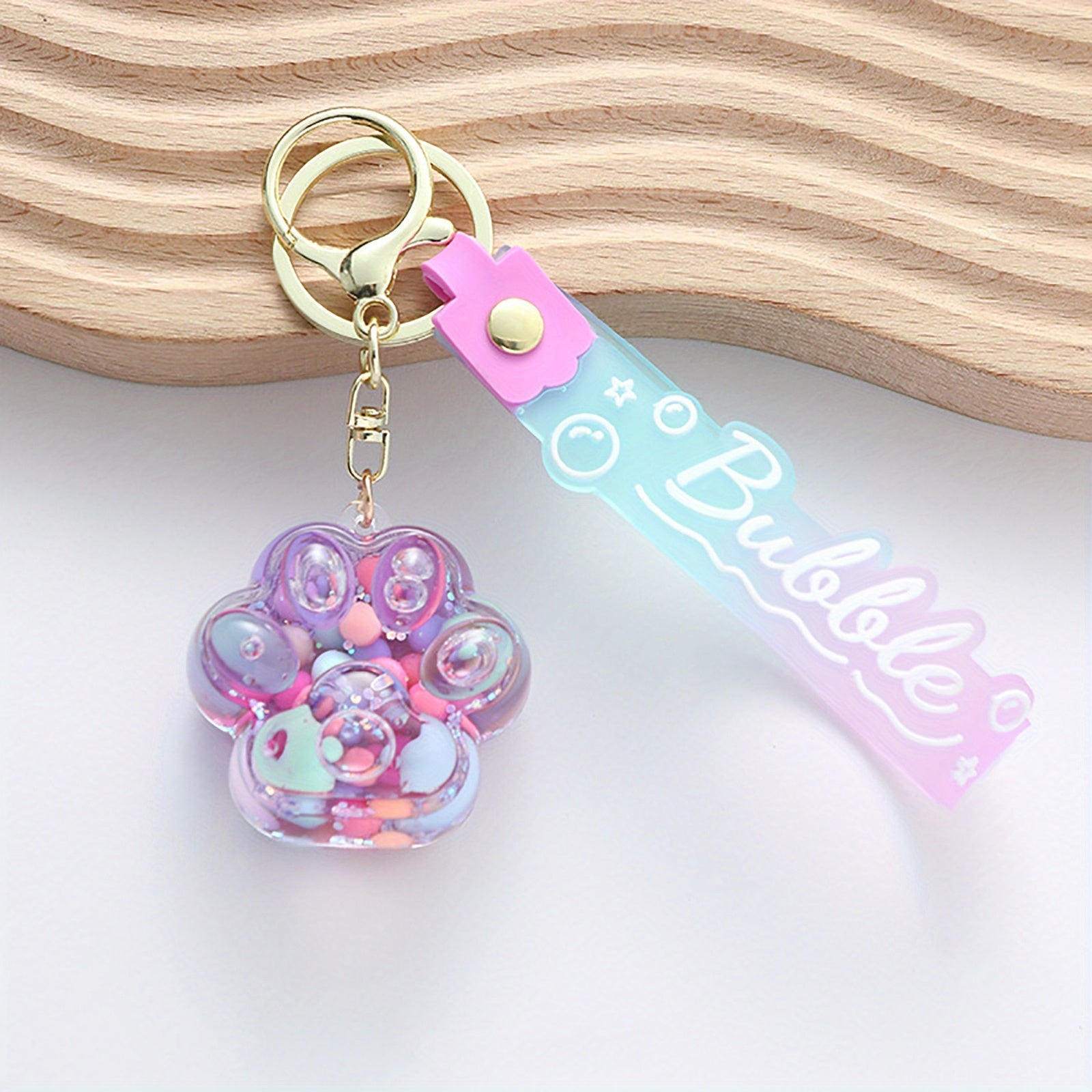 Llavero de pata de gato adorable con colgante de piruleta de gelatina flotante de arena movediza para bolsos y mochilas