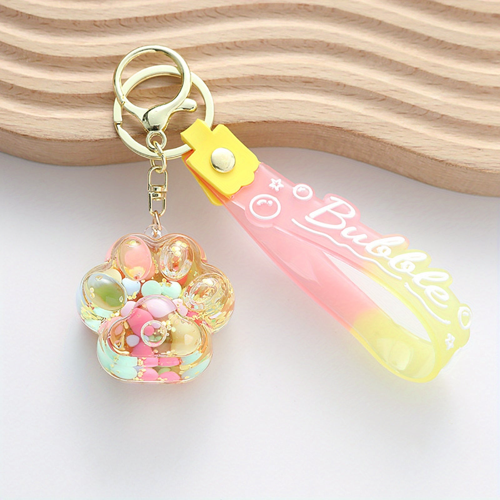 Llavero de pata de gato adorable con colgante de piruleta de gelatina flotante de arena movediza para bolsos y mochilas