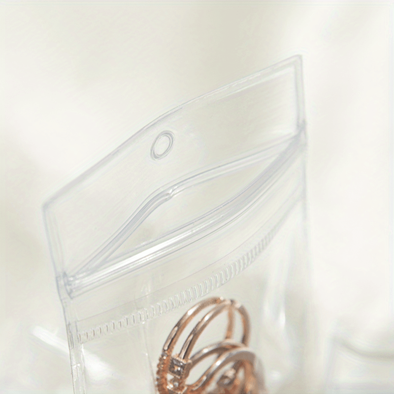 Paquete de 20 bolsas de joyería de PU transparente para organizar anillos, pendientes y collares