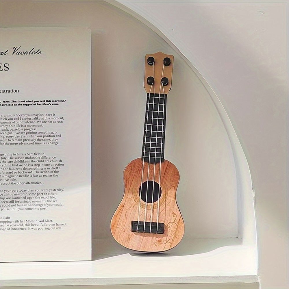 Modelo de guitarra miniatura decorativa de color amarillo claro con soporte y caja de almacenamiento