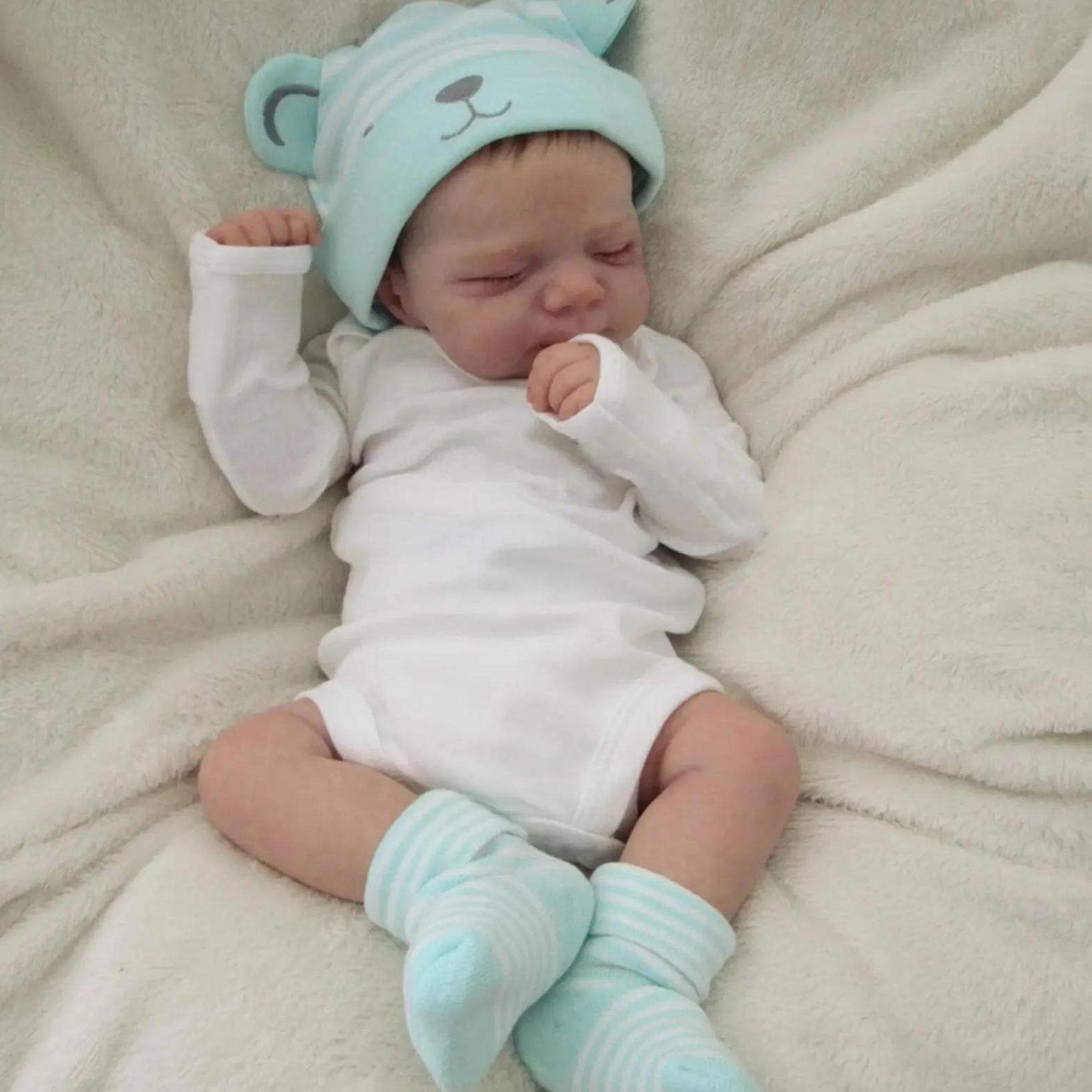 18-Inch Reborn Girl Doll with Blue Bear Hat Soft Vinyl Lifelike Sleeping Pose for Children 3+