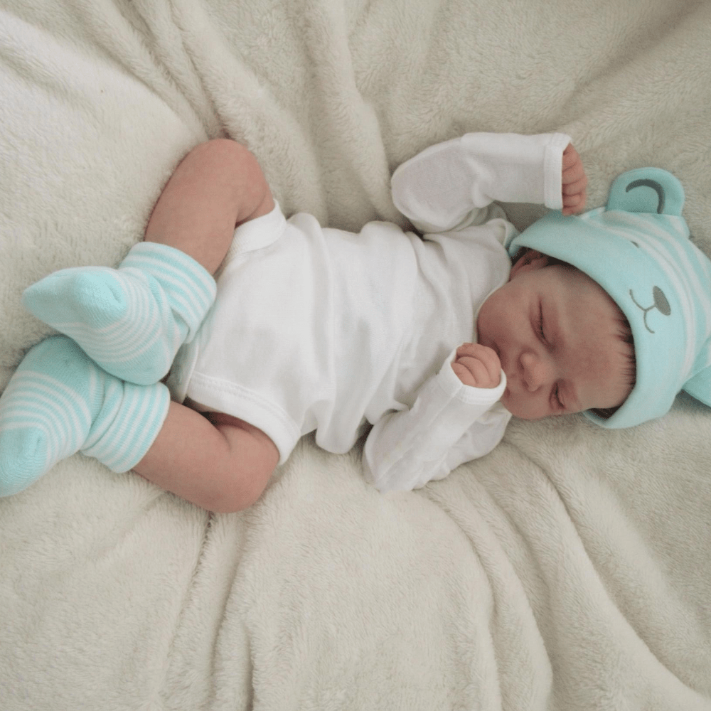 18-Inch Reborn Girl Doll with Blue Bear Hat Soft Vinyl Lifelike Sleeping Pose for Children 3+
