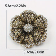 Retro Rhinestone Flower Brooch with Pearl Embellishments and Filigree Cut-Out Design
