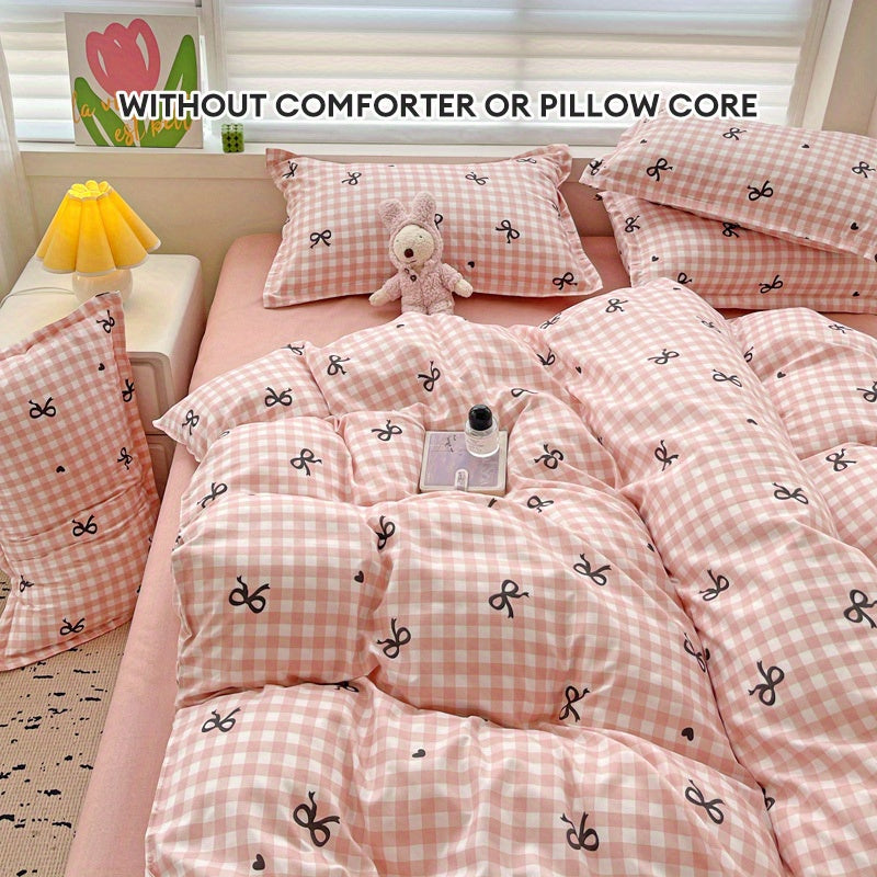 Conjunto de funda nórdica a cuadros rosa con patrón de lazo de 4 piezas de poliéster para todas las estaciones