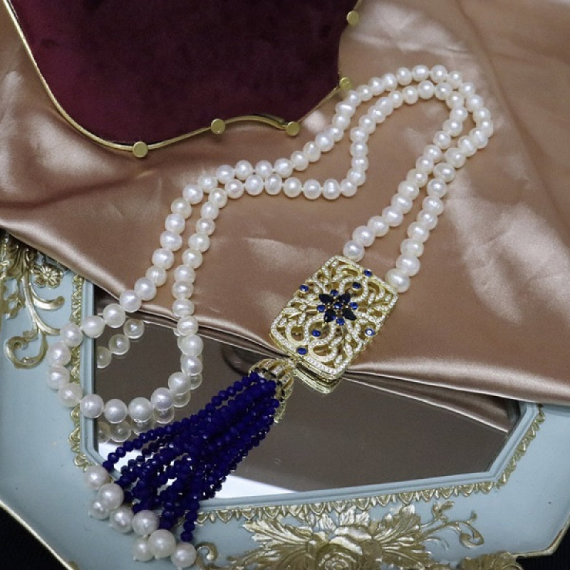 Vintage uslubidagi shirin suv marvaridli sviter bilaguzuk, Chexiya kristall tassellari bilan bezatilgan - har qanday tadbir uchun nafis va ko'p qirrali, sovg'a qutisi bilan birga mukammal sovg'a.