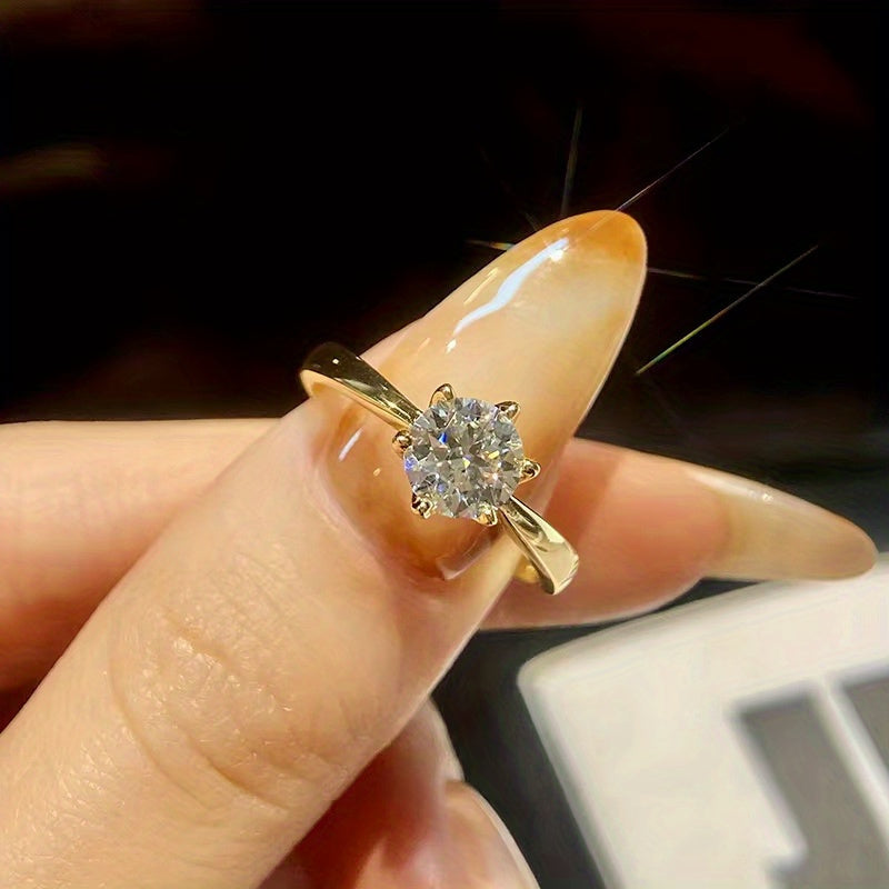 Sevgi kuni sovg'asi: 925 sterling kumushda, 18K oltin qoplamali, sovg'a qutisi bilan mo'jizaviy moissanit to'y uzuk. 6 ta prong bilan jhumka uslubida, tantana va ta'til uchun, ayollar uchun mukammal yozgi to'y uzuki.