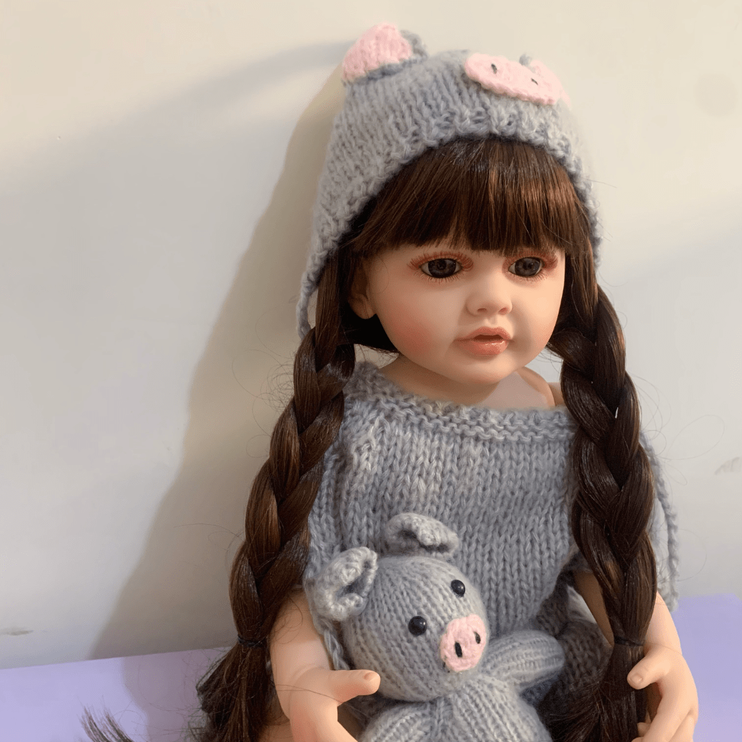 22 Inch Vinyl Reborn Girl Doll with Long Hair and Plush Toy for Ages 3+