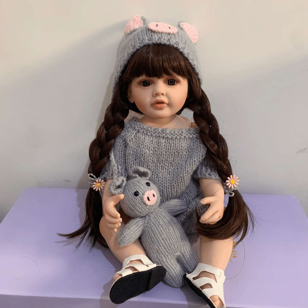 22 Inch Vinyl Reborn Girl Doll with Long Hair and Plush Toy for Ages 3+