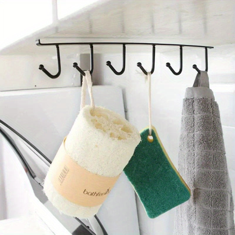 Kofe chashkalari, kamarlar va sharfalarni joylashtirish uchun joyni tejovchi oshxona shkafi tashkilotchisi. Ushbu mustahkam plastik saqlash tokchasi 6 ta ilgichga ega bo'lib, oshxonangizni tartibga solish uchun juda mos keladi.