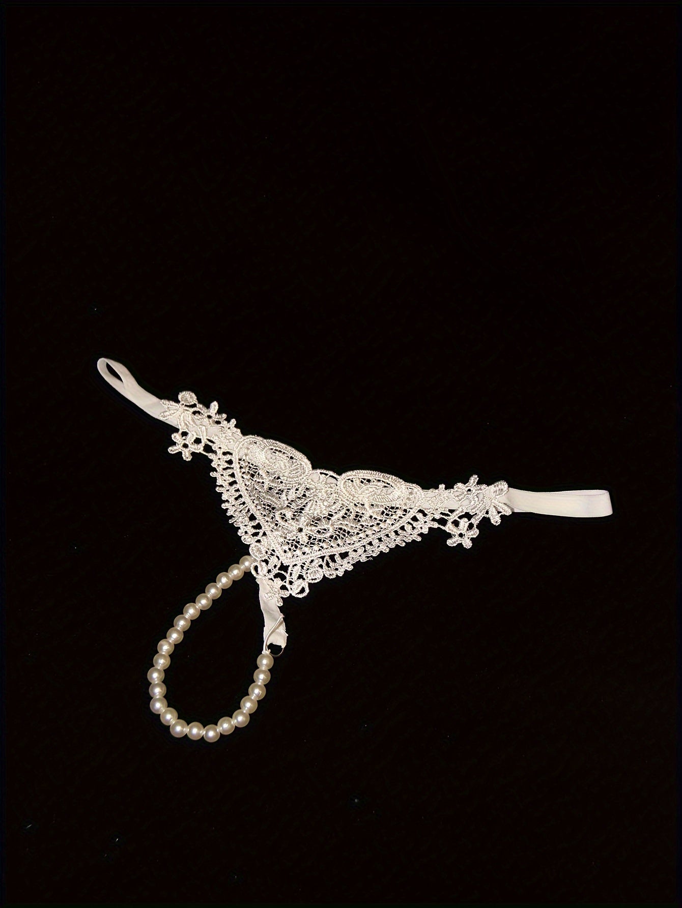 Низкие стринги с перловыми украшениями и вырезами. Дышащий полиэстер, можно стирать вручную. Идеально для взрослых.