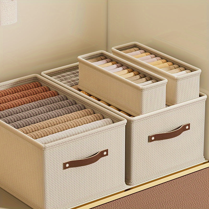 Qo‘lqopli to‘g‘ri burchakli saqlash qutilari, shkaflar yoki yotoq javonlari uchun mukammal. Ushbu yig‘iladigan mato qutilar kulrang yoki bej rangda bo‘lib, joyingizni tartibga solishda ideal. Yotoq osti saqlash uchun ham juda yaxshi!
