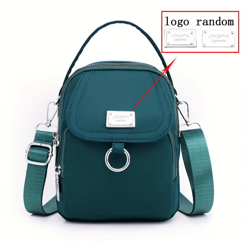 Ayollar uchun nylon crossbody sumka, katta sig'imli, bir rangli, zip yopilishi, polyester astarli, kundalik foydalanish va maxsus tadbirlar uchun ko'p funksiyali, qizil yoki qora ranglarda mavjud.