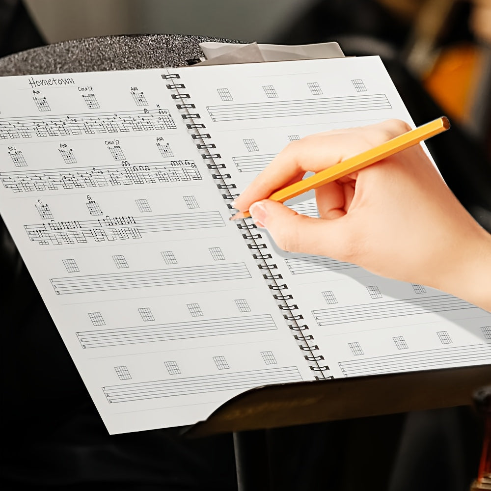 Cuaderno de práctica de guitarra con 50 hojas en blanco con pentagramas y diagramas de acordes