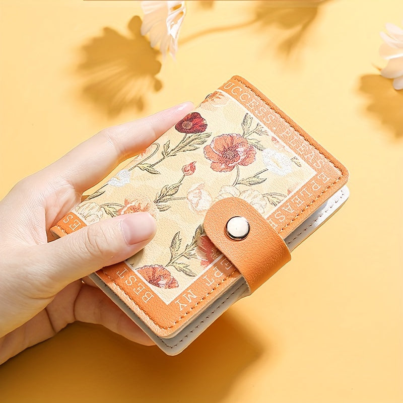 Sintetik charmli ayollar uchun hamyon, bir nechta karta joylari, tugmachali yopilish va yorqin atirgul dizayni bilan.