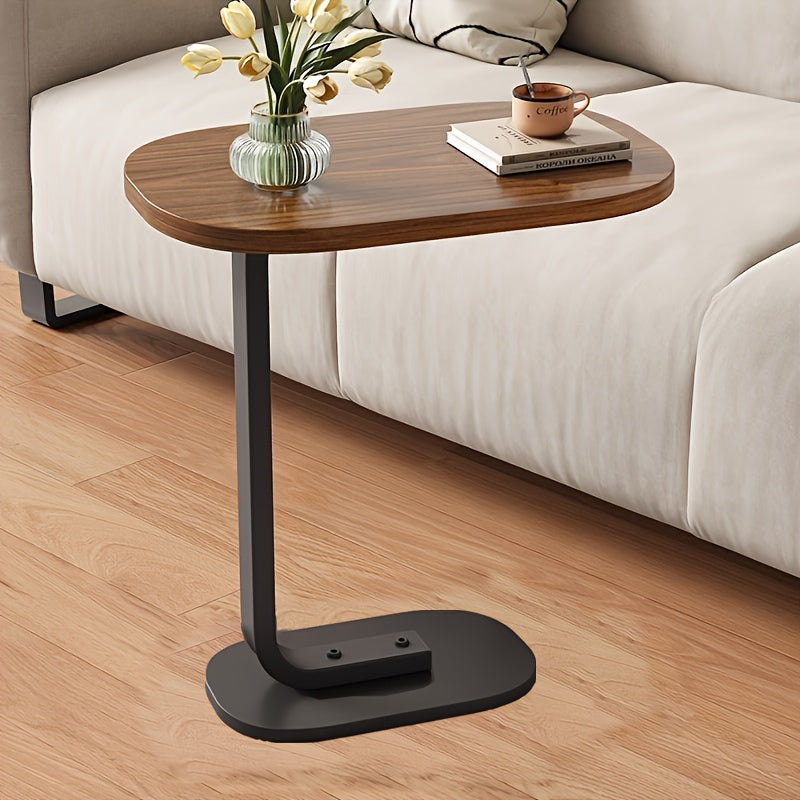 Zaytun yog'ochi va temirdan yasalgan zamonaviy C-shaklidagi divan yon stoli, mustahkam qora ramkaga ega. Turli joylar uchun mos, ixcham va bardoshli dizayn.