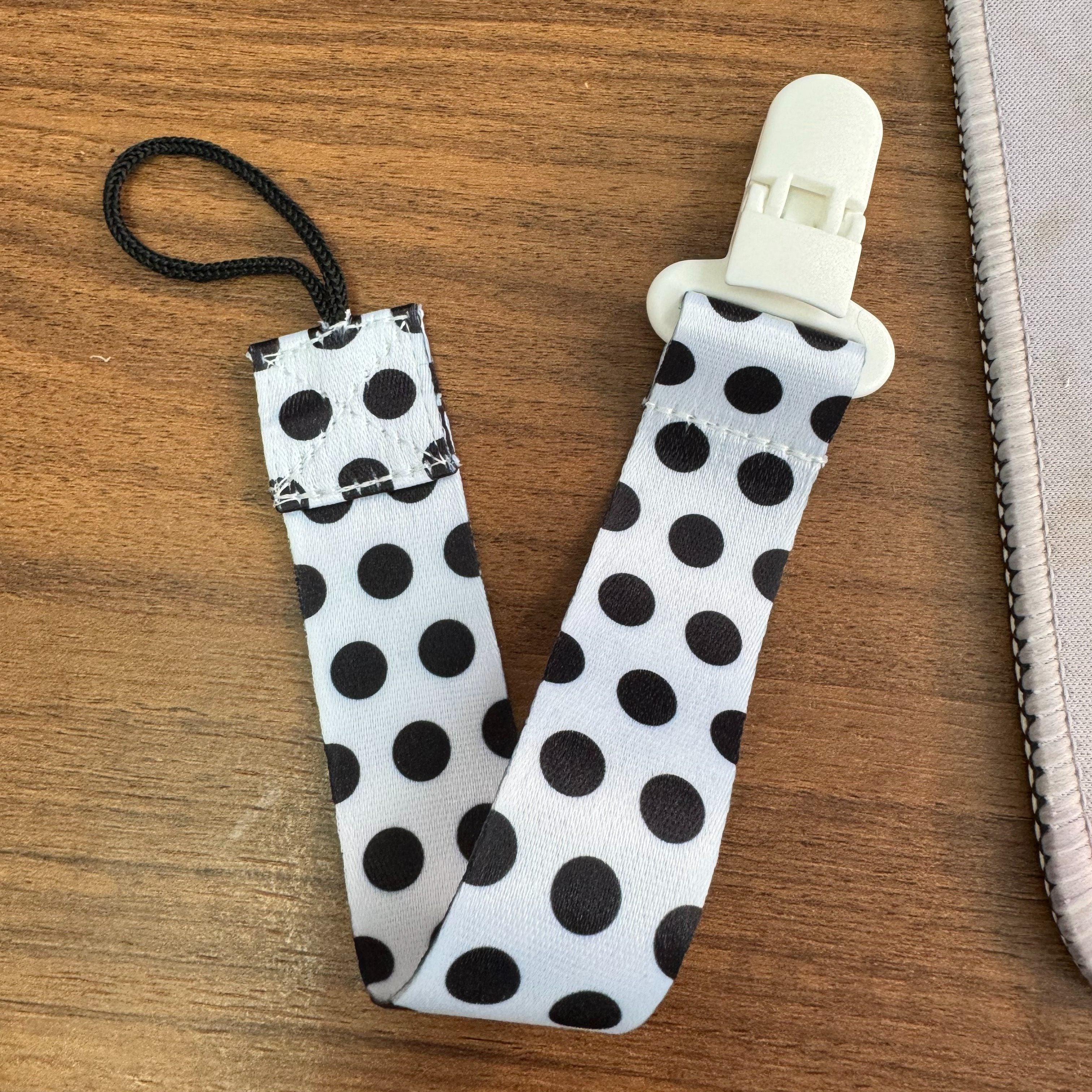 Clip de chupete de plástico de dibujos animados con patrón caprichoso y clip de sujeción