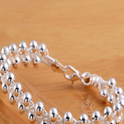 Стильный и художественный ручной браслет с серебром 925 пробы и детализированными бусинами