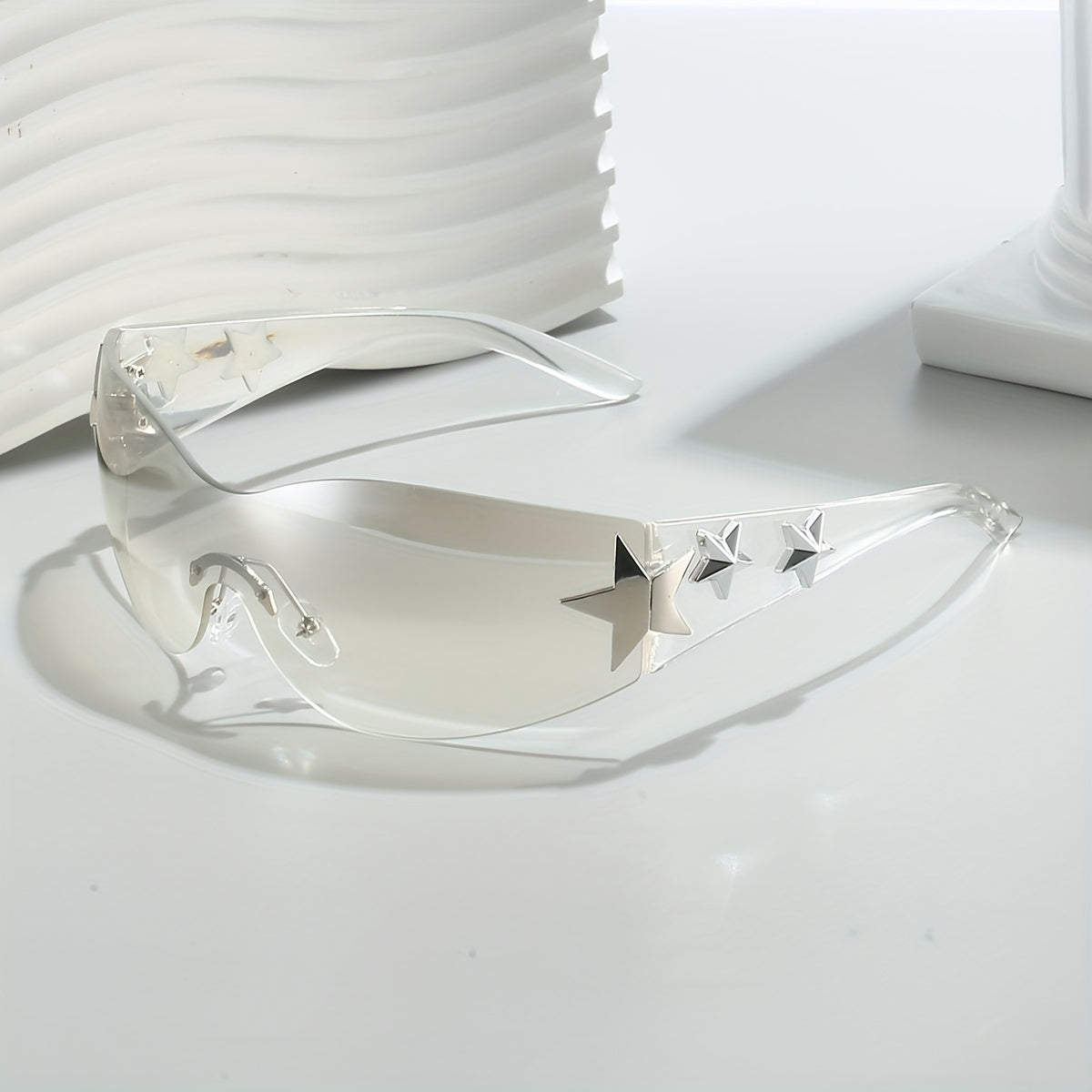 Gafas de moda unisex de gran tamaño con diseño futurista sin marco y decoraciones de estrellas
