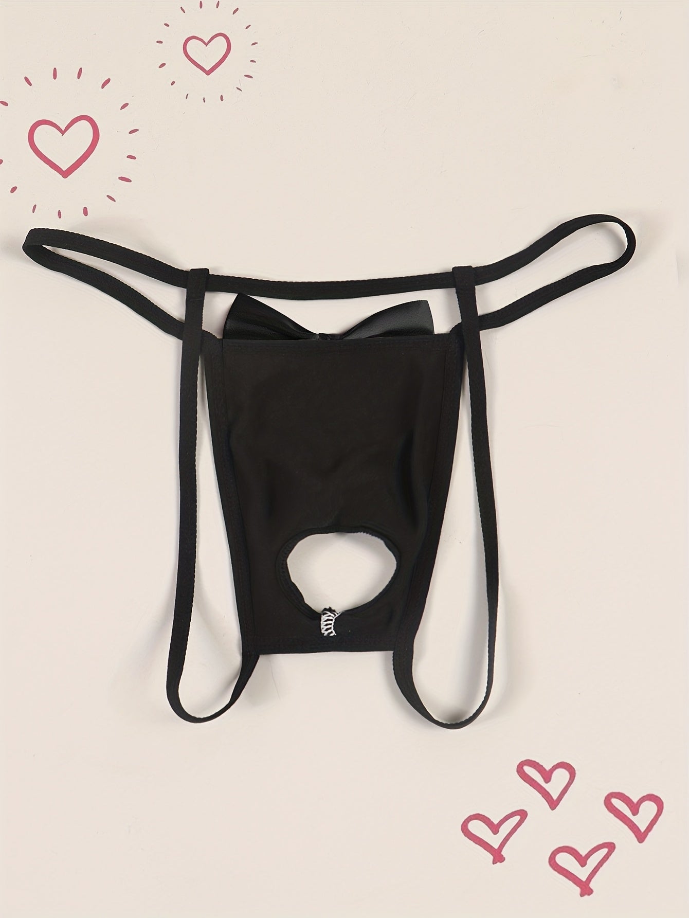 Erkaklar uchun sexy qora thong, old qismida kesilgan va kamon detali bilan, "Faqat Mening Xotinim Uchun" qizil gul printi bilan. Qulay, nafas oladigan poliamid (90%) va elastan (10%) to'qima matodan tayyorlangan.