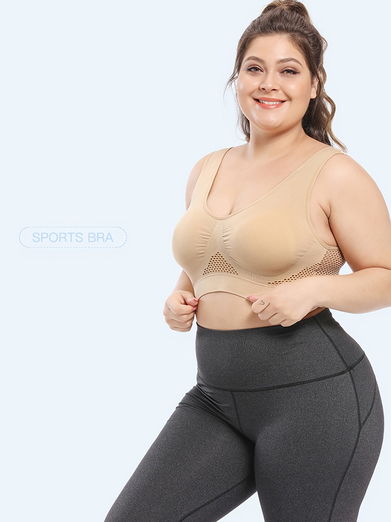 Sujetador deportivo sin costuras para mujer de talla grande en color morado con malla transpirable, con relleno push-up y pads removibles