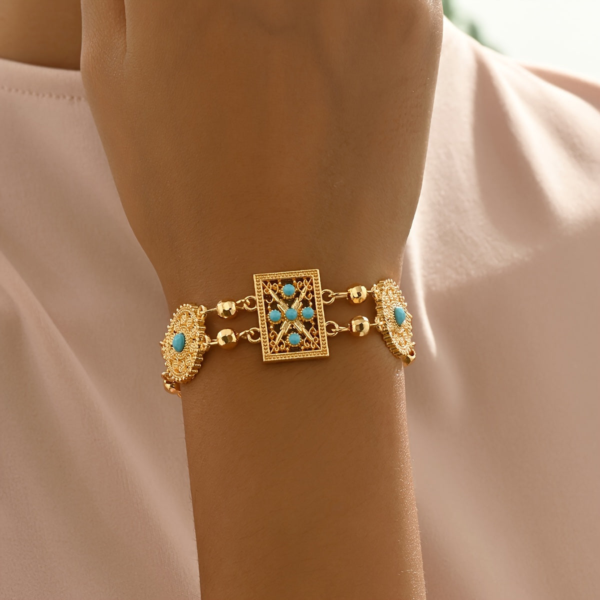 Women’s Gold Plated Alloy Bracelet with Geometric Cut-Out and Blue Cubic Zirconia